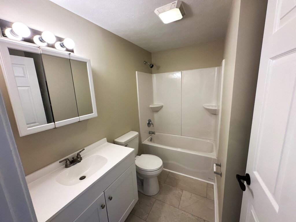 Full bathroom inside a two-bedroom Patio Home at Country Club Hills, Steubenville, with vanity and fixtures