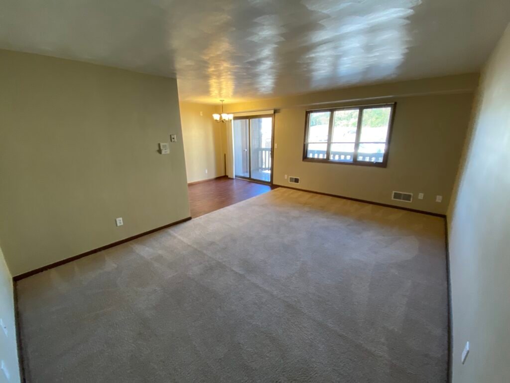 Spacious living room in a two-bedroom Garden Apartment at Country Club Hills, Steubenville, with open layout.