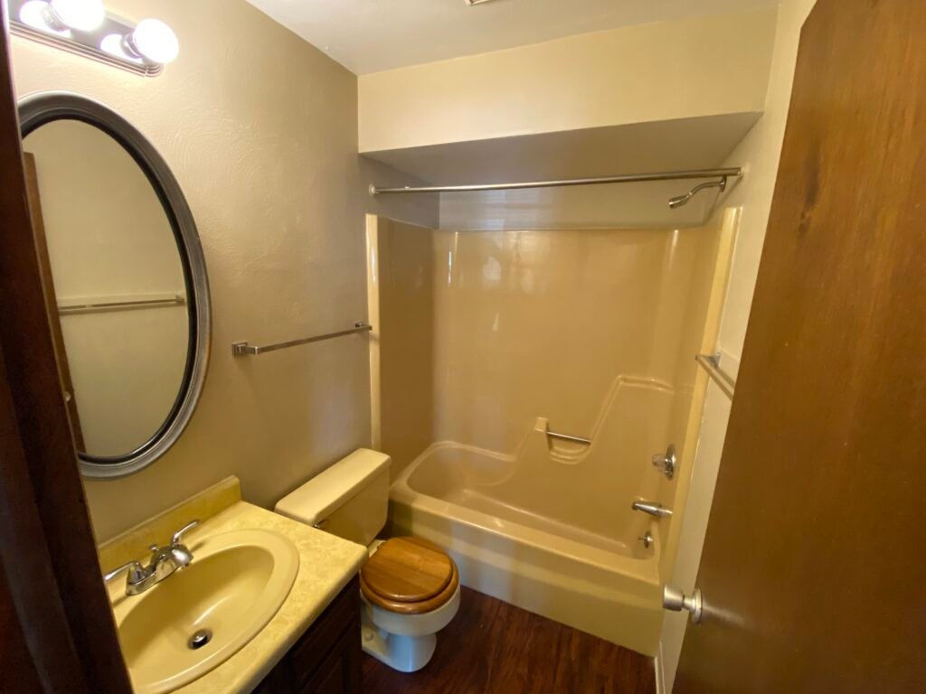 Full bathroom in a two-bedroom Garden Apartment at Country Club Hills, Steubenville, with vanity and fixtures.