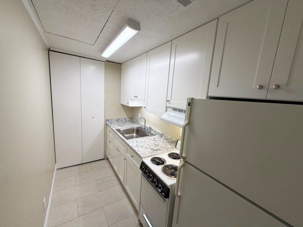 Second view of the kitchen in a one-bedroom Patio Home at Country Club Hills, Steubenville, showing counters and appliances