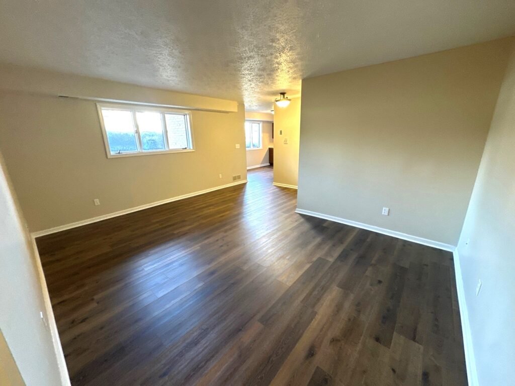 Spacious living room in the Garden Apartments at Country Club Hills, Steubenville, with bright open layout.
