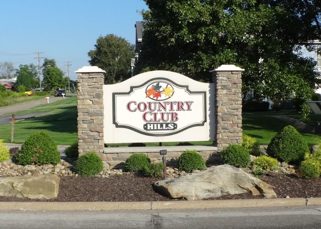 Entrance sign to Country Club Hills subdivision where Orecchio Properties has many apartments and townhomes for rent. 