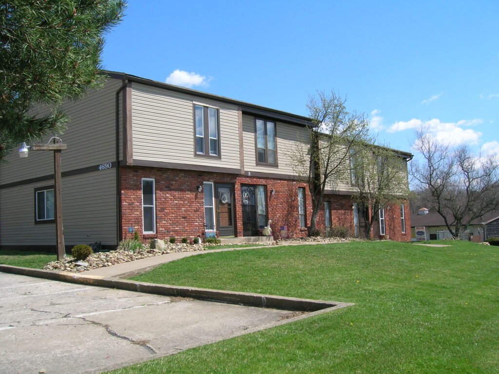 Front exterior view of the Scioto Townhouses at Country Club Hills in Steubenville, with landscaped grounds and private entrances.