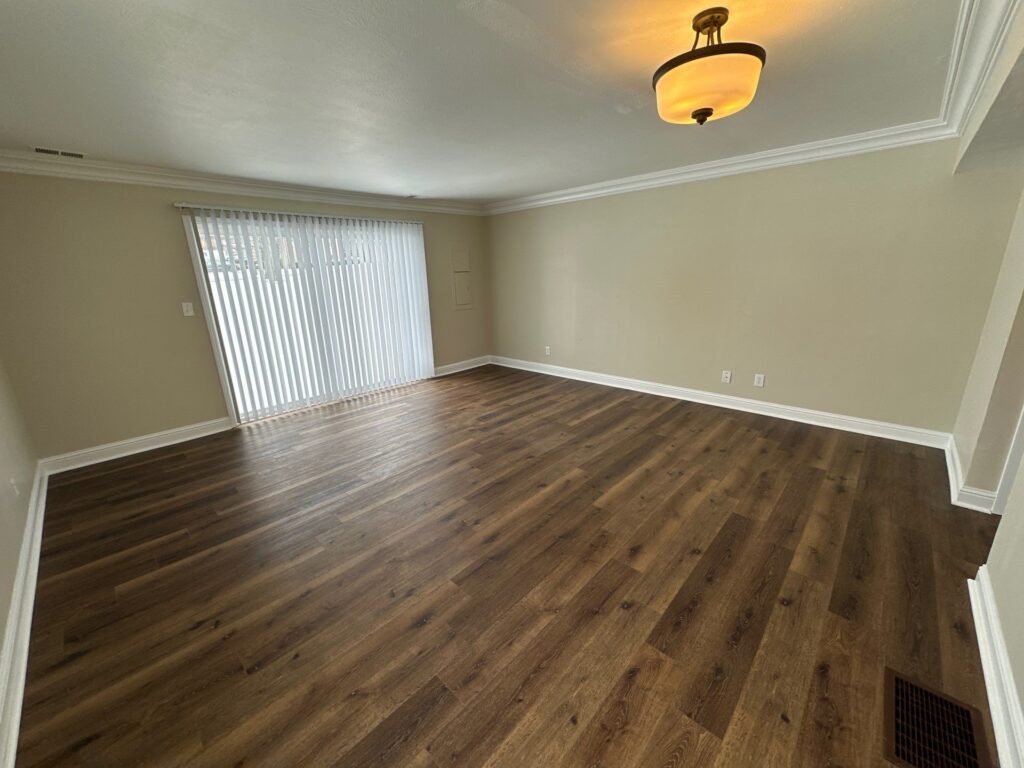 Open living room and dining area inside a Scioto Townhouse at Country Club Hills in Steubenville, spacious floor plan view