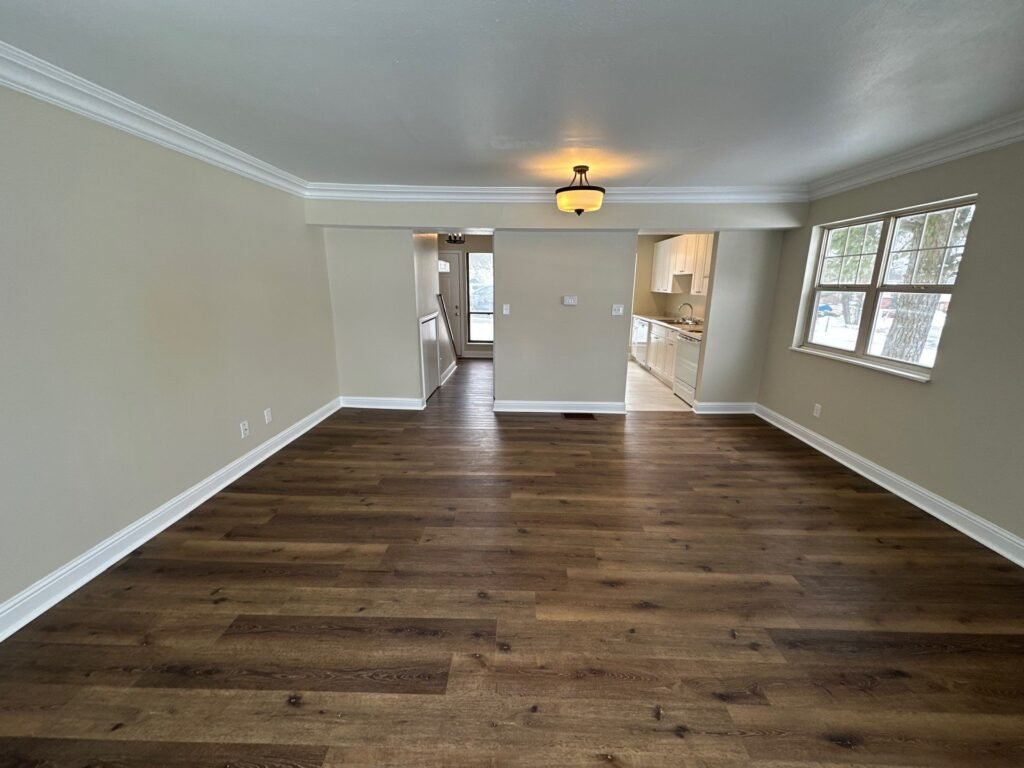Third view of the open living room and dining area inside a Scioto Townhouse at Country Club Hills in Steubenville